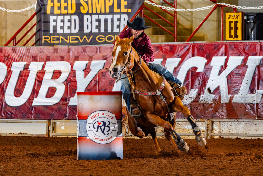 person riding a horse around Ruby Buckle barrel