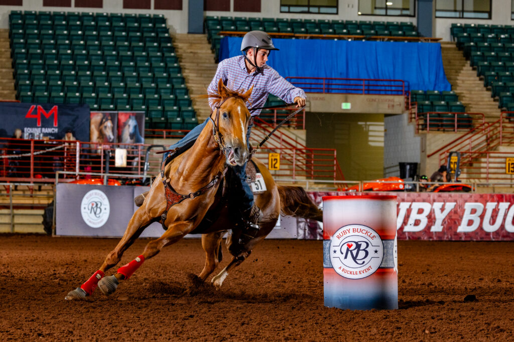 Man in a helmet riding a red horse