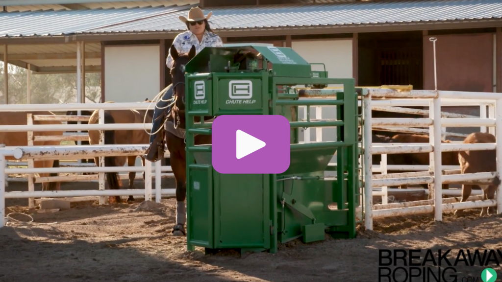 Breakaway roper on horseback waits in the box beside a green Chute Help roping chute in a sunny practice pen