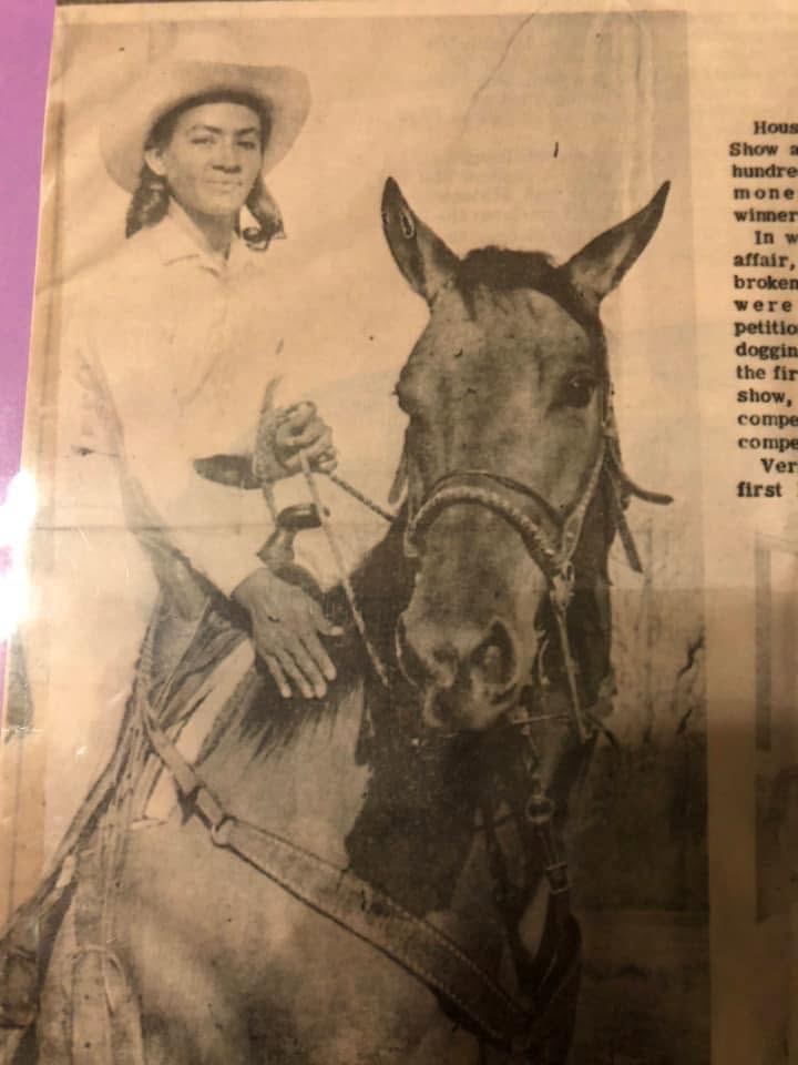 Woman sits on horse in cowboy hat in newspaper clipping
