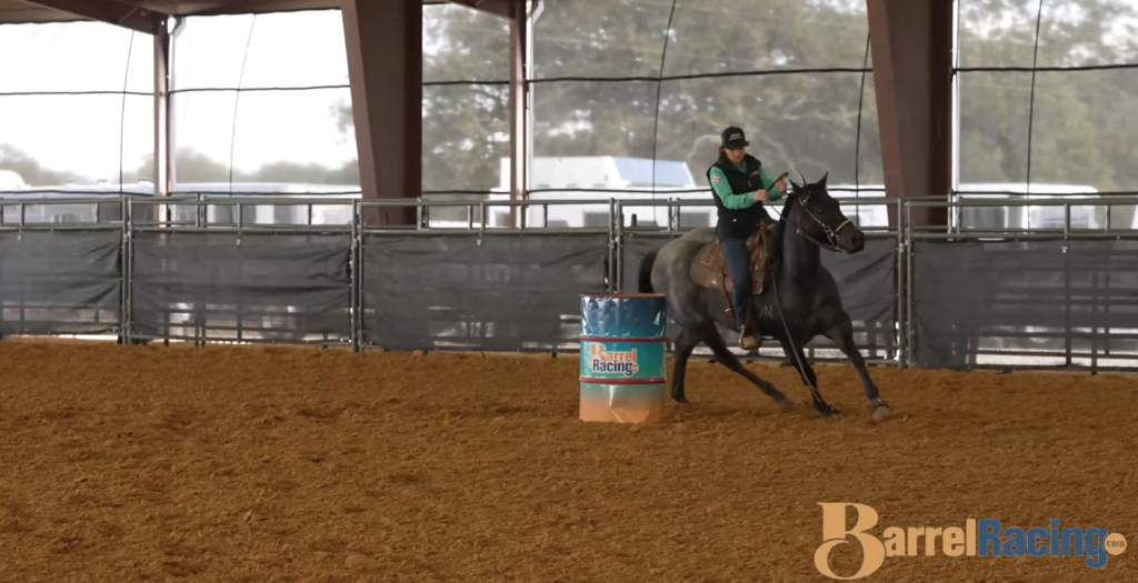 Jordan Briggs counterbending a horse around a barrel.