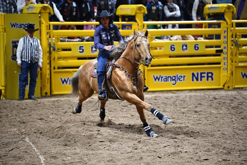 Latricia Duke barrel racing on DM High Roller