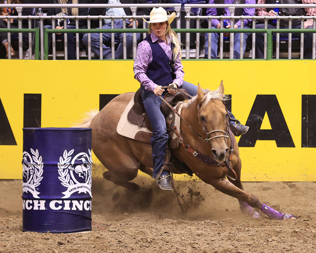 Sadie Wolaver barrel racing at college national finals rodeo