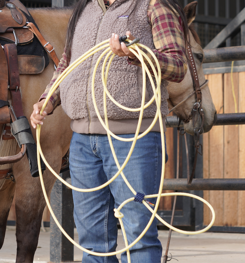 Check out Danielle Lowman's finished practice rope setup. The tail of the rope will cinch up—thanks to the horn knot—around the saddle horn and keep it secure during practice.
