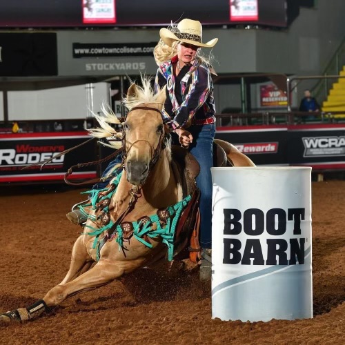 Wylie Jo Hodges and "Jules" round turn two at the Women's Rodeo World Championship.