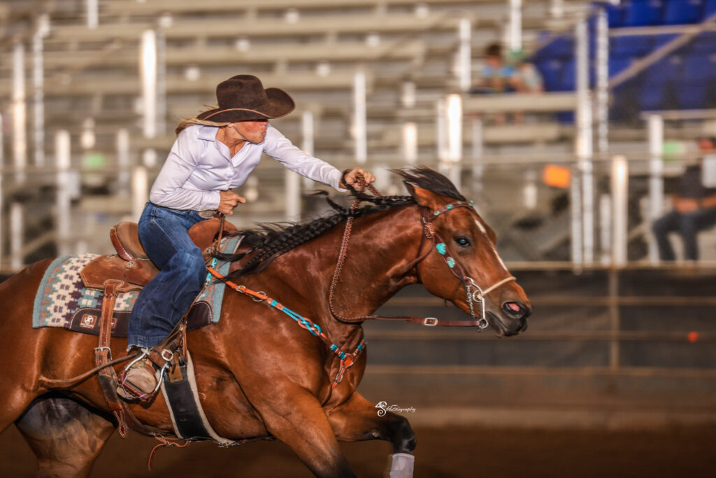 Kim Schulze runs home on her bay horse