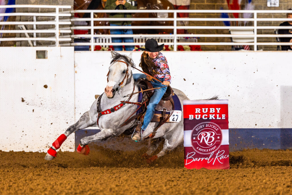 child Tallyn Blake turns a barrel