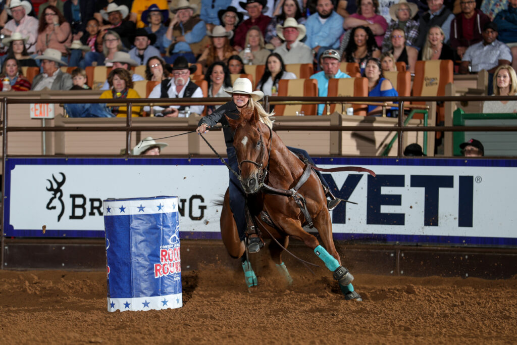 Kalli McCall competing in barrel racing in Cowtown Coliseum.