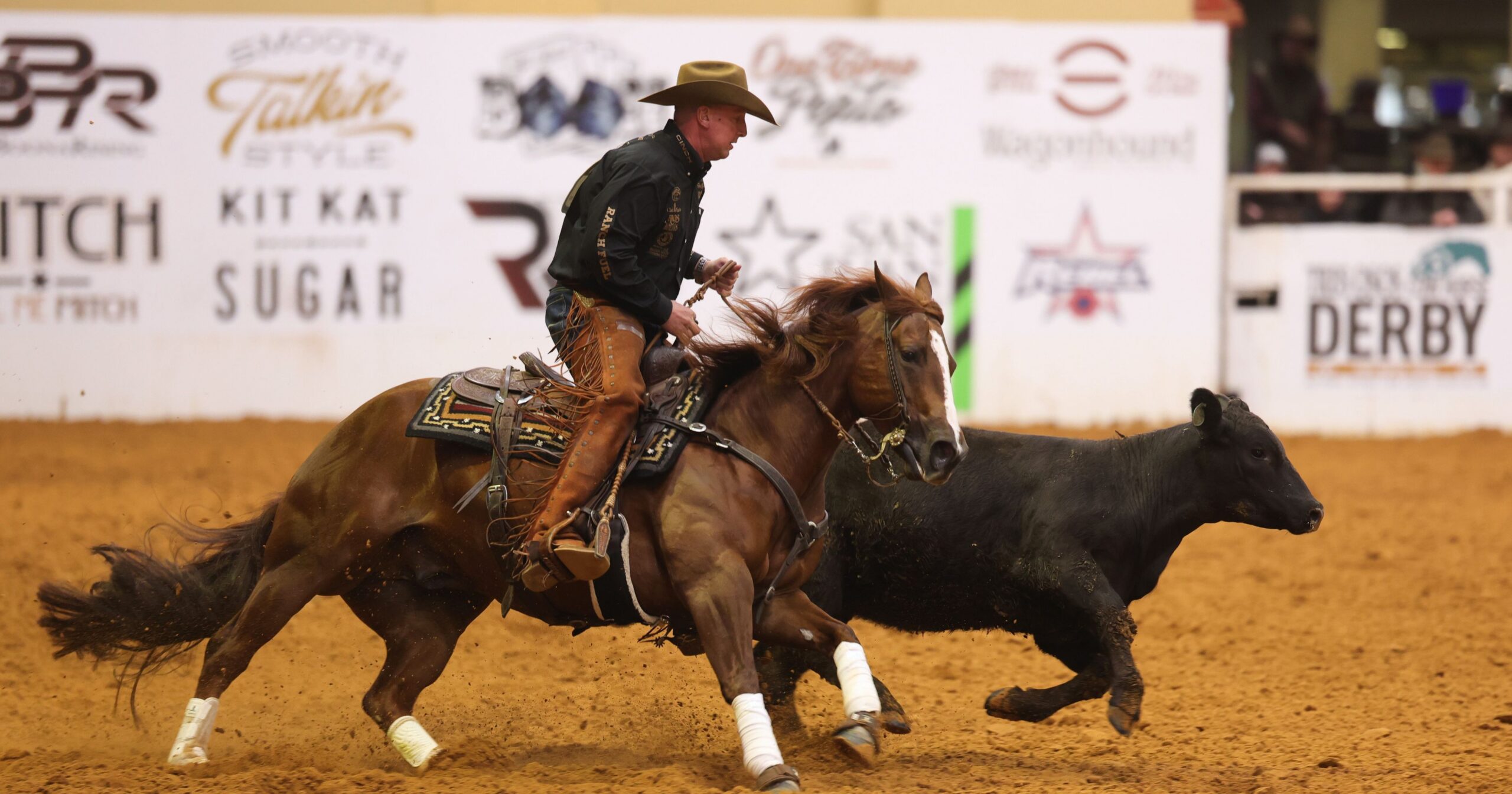 Corey Cushing and WR Iceman circle up on their cow at the 2026 NRCHA World's Greatest Horseman Fencework preliminaries.
